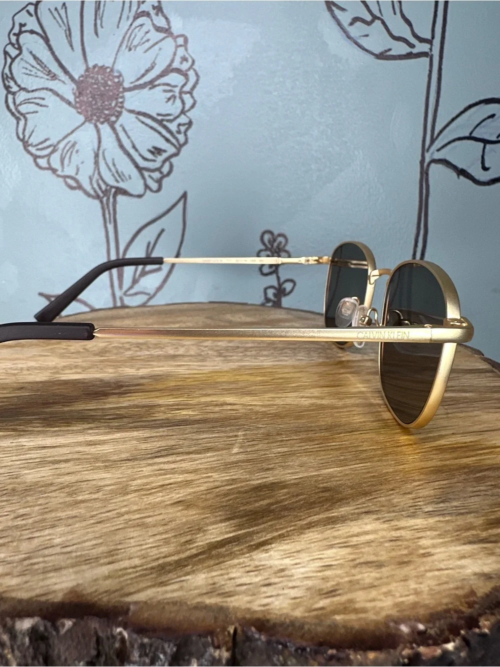 Calvin Klein Gold Frame Sunglasses with Dark Lenses